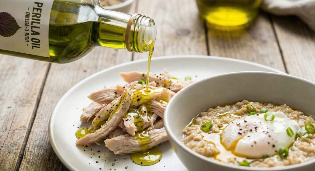 Golden perilla oil being drizzled over chicken breast, highlighting the omega-3 coating technique for biohacking.