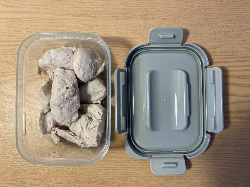 Premium poached chicken breast prepared with onion and garlic for the Bridget June Biohacking routine.